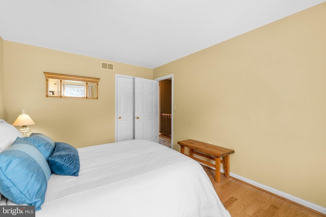 bedroom with wood-type flooring