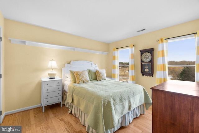 bedroom with light wood-type flooring