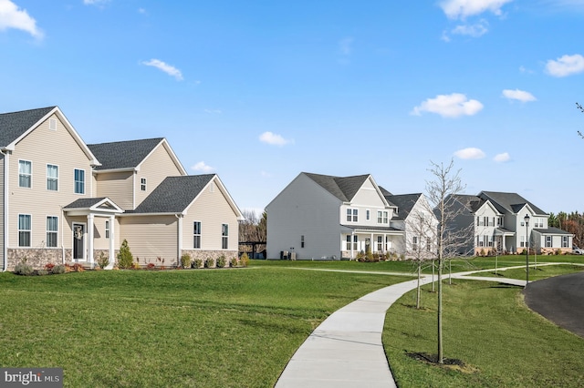 view of home's community featuring a yard