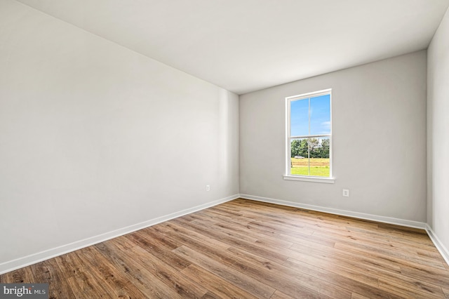 empty room with light hardwood / wood-style floors