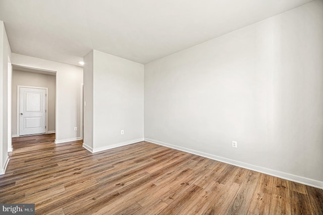 empty room featuring wood-type flooring