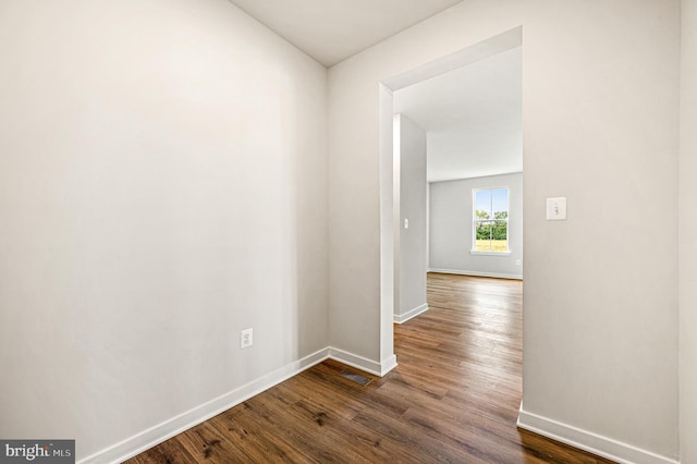 hallway featuring dark hardwood / wood-style floors