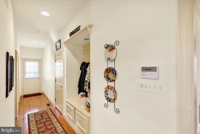 mudroom with light hardwood / wood-style flooring