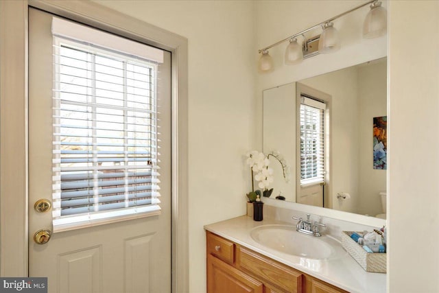 bathroom with vanity and toilet