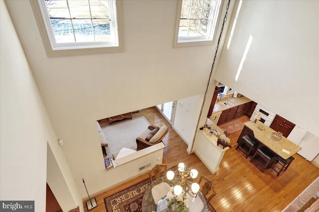 living room with sink and light hardwood / wood-style flooring