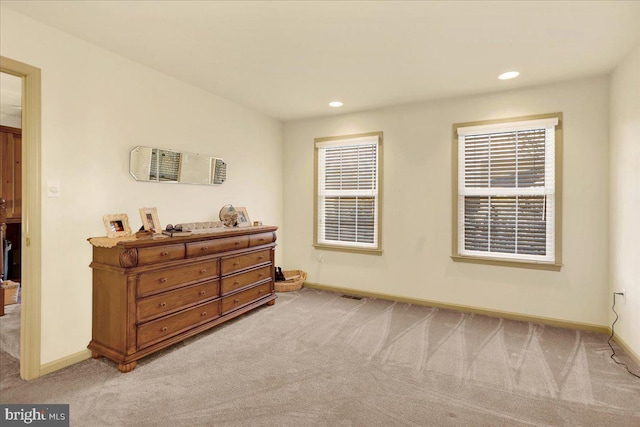 bedroom with light colored carpet