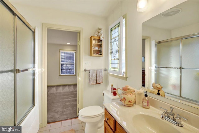 full bathroom featuring toilet, tile patterned floors, shower / bath combination with glass door, and vanity