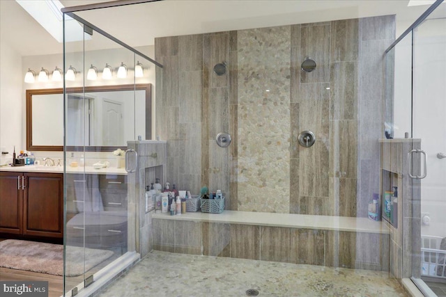 bathroom with vanity and an enclosed shower