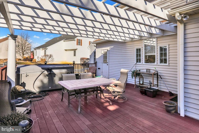 wooden terrace with a hot tub and a pergola