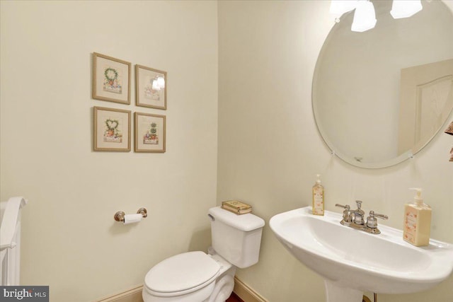 bathroom with toilet and sink