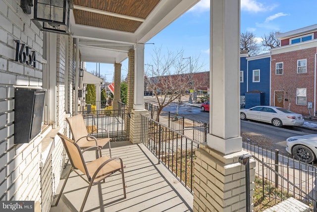 balcony featuring a porch