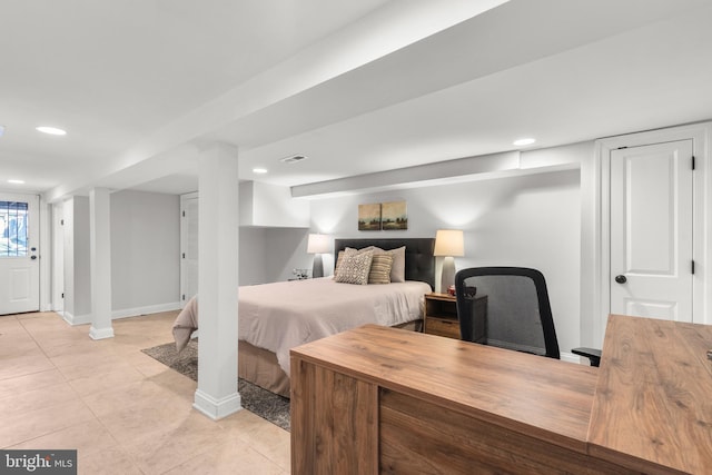 bedroom featuring light tile patterned flooring