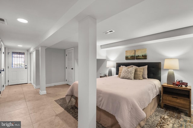 bedroom featuring light tile patterned floors