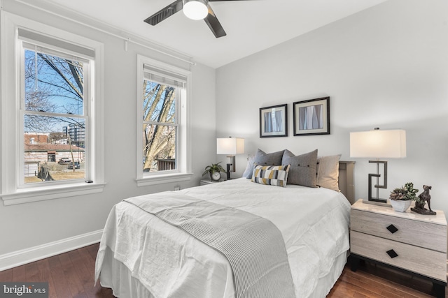 bedroom with dark wood-type flooring and ceiling fan