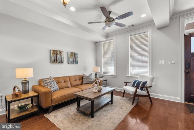 living room with crown molding, ceiling fan, and dark hardwood / wood-style flooring