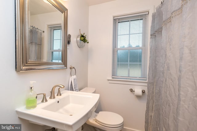 bathroom featuring toilet and sink