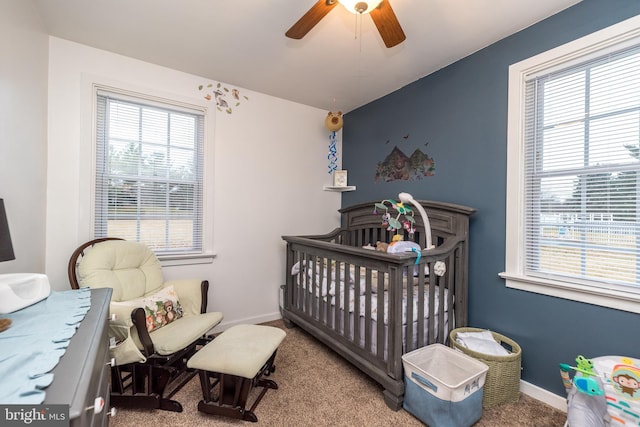 carpeted bedroom with ceiling fan