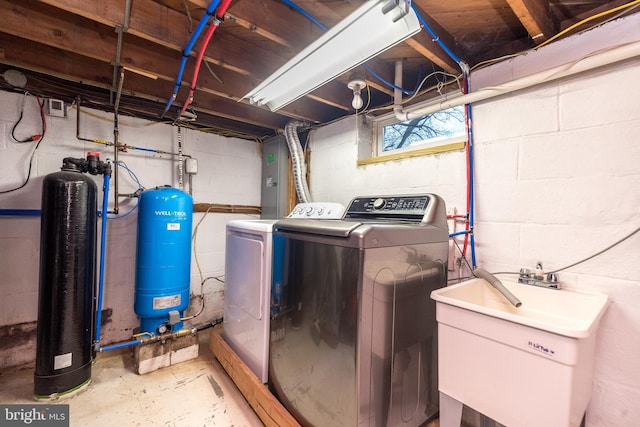 washroom featuring washing machine and clothes dryer and sink