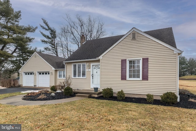 view of front facade with a garage and a front lawn