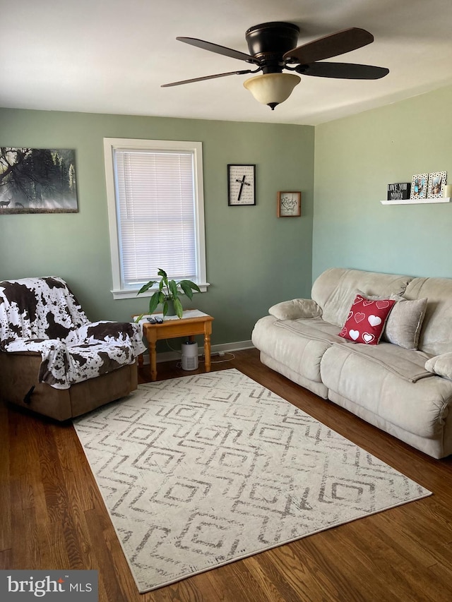 living room with hardwood / wood-style flooring and ceiling fan