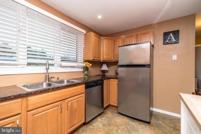 kitchen featuring stainless steel appliances and sink