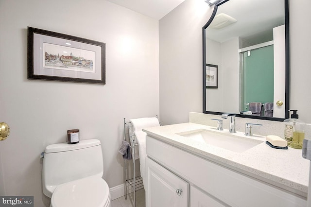 bathroom with vanity, toilet, and an enclosed shower