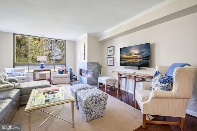 living room featuring a fireplace, ornamental molding, and wood-type flooring