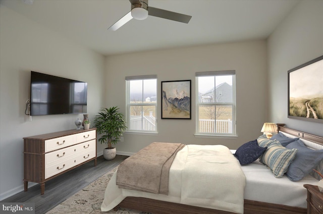 bedroom featuring dark hardwood / wood-style floors and ceiling fan