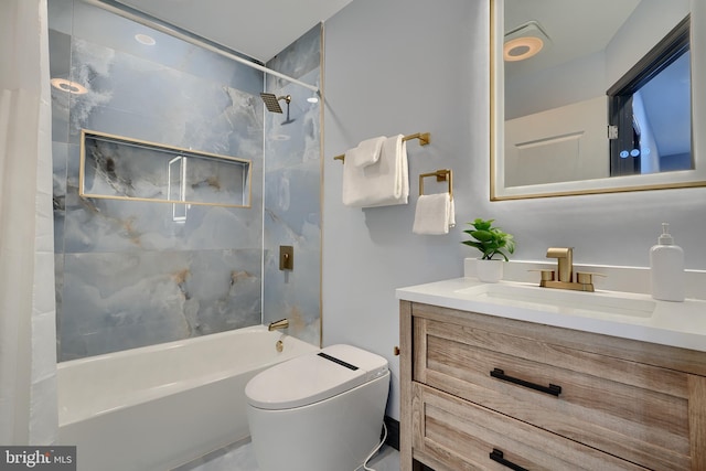 full bathroom featuring vanity, toilet, and tiled shower / bath combo