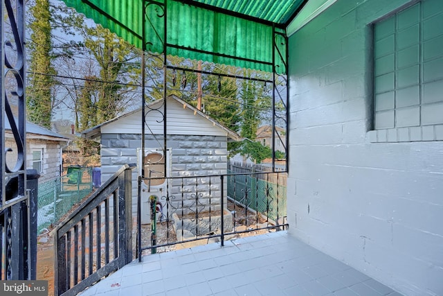 wooden deck featuring an outbuilding