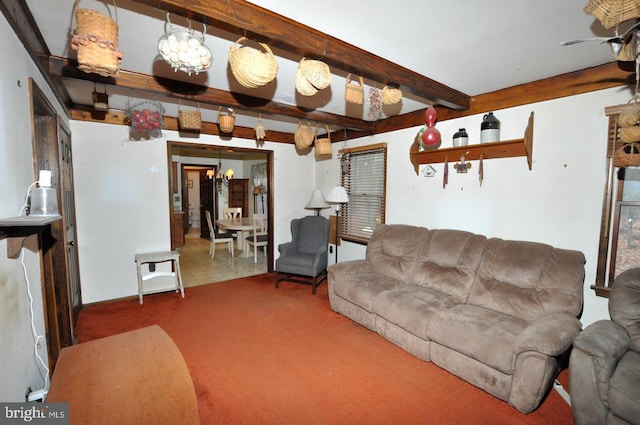 carpeted living room featuring a notable chandelier and beam ceiling