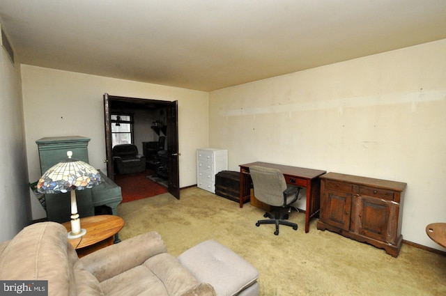 office area featuring light carpet