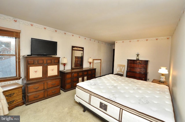 bedroom featuring light colored carpet