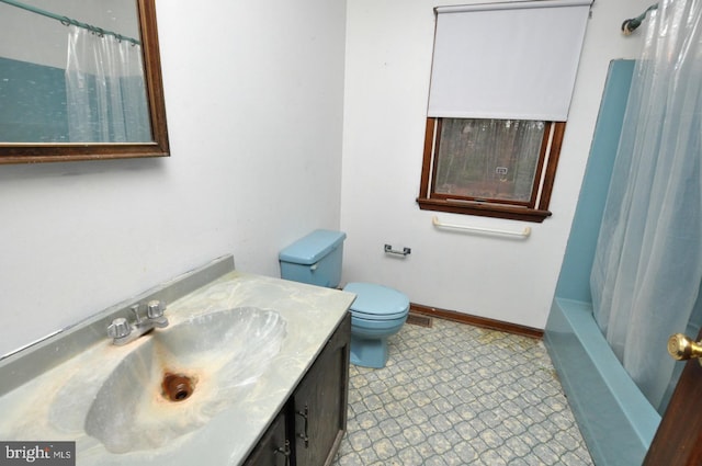 full bathroom featuring vanity, toilet, and shower / tub combo