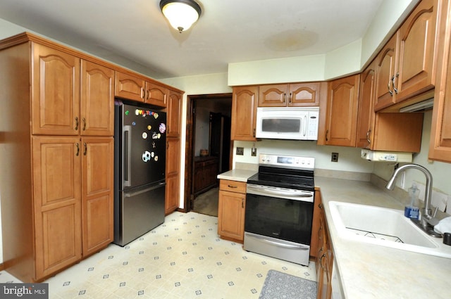 kitchen featuring appliances with stainless steel finishes and sink