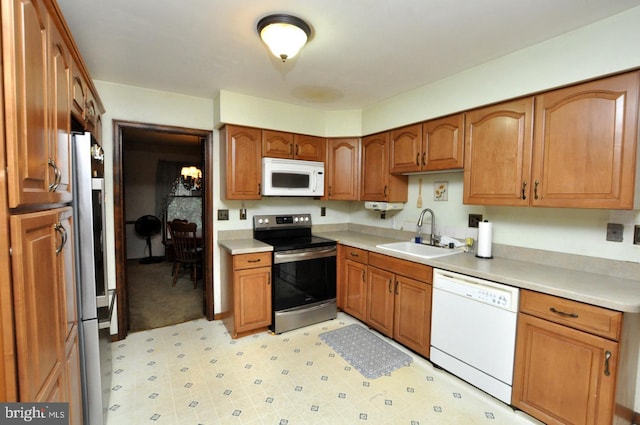 kitchen featuring appliances with stainless steel finishes and sink