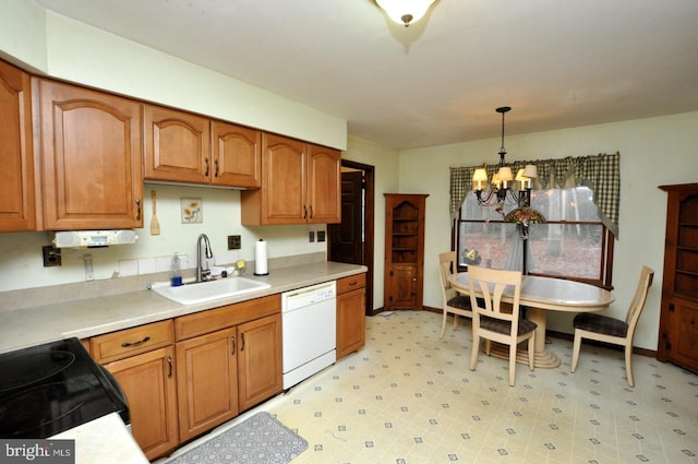 kitchen with sink, an inviting chandelier, black electric range, white dishwasher, and pendant lighting