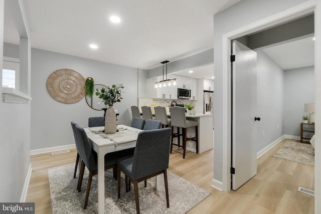 dining room featuring light hardwood / wood-style flooring