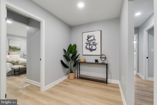 hall with light wood-type flooring