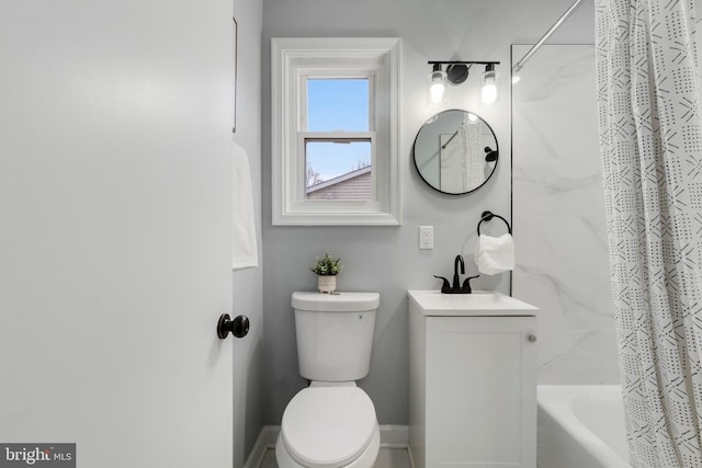 full bathroom with vanity, shower / tub combo, and toilet