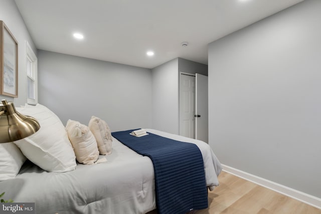 bedroom with light hardwood / wood-style floors