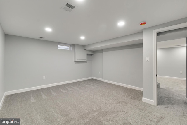 basement with light colored carpet