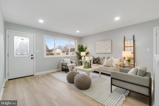 living room with light hardwood / wood-style flooring