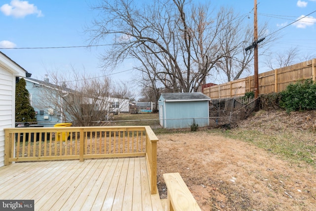 wooden terrace featuring a storage unit