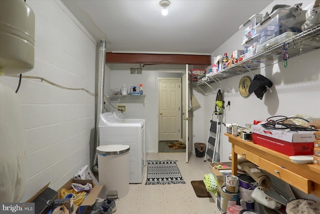 washroom with independent washer and dryer