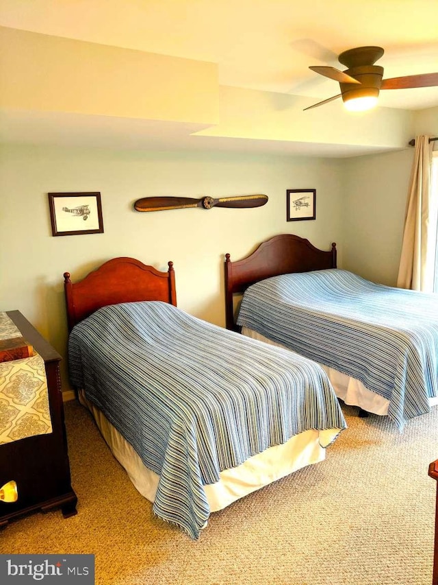 carpeted bedroom with ceiling fan