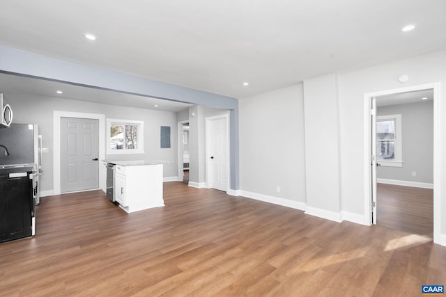 living room featuring wine cooler and light wood-type flooring