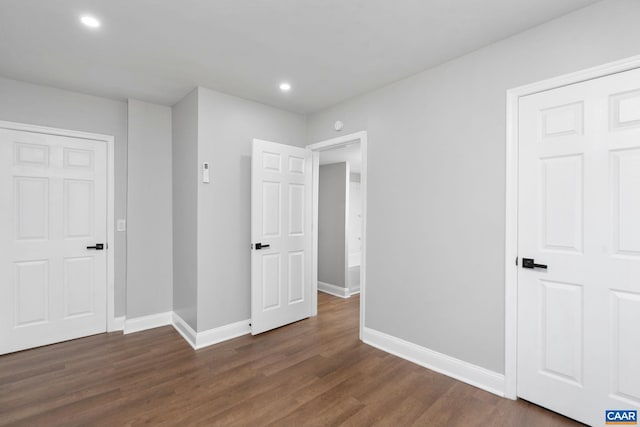 interior space with dark hardwood / wood-style flooring