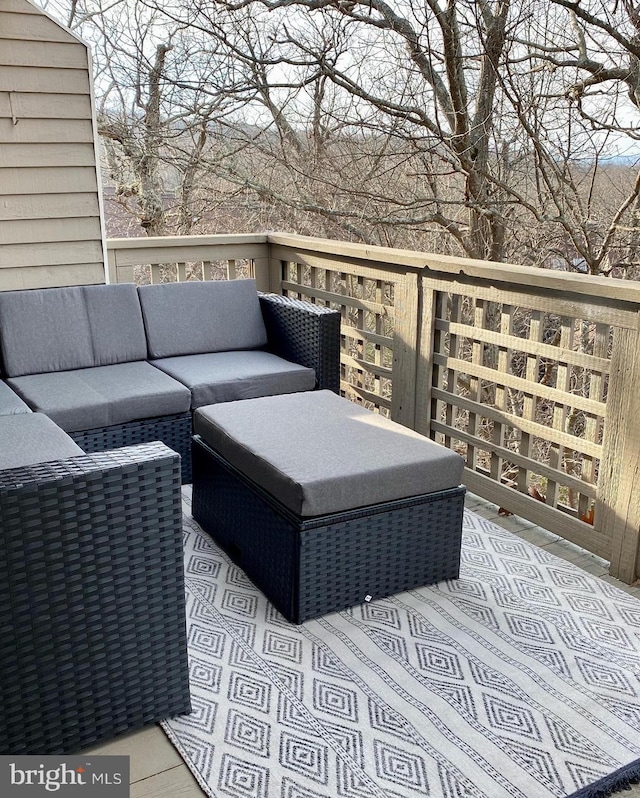 wooden deck featuring an outdoor living space