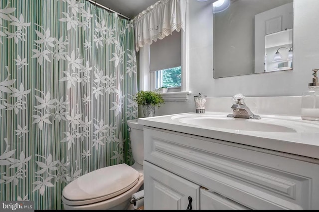 bathroom with vanity and toilet